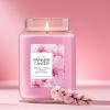 imageYankee Candle Lilac Blossoms Scented Classic 22oz Large Jar Single Wick Candle Over 110 Hours of Burn Time Perfect for Gifting Gatherings and Seasonal DecorationsEnchanting Cherry Blossom