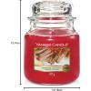 imageYankee Candle Buttercream Scented Classic 22oz Large Jar Single Wick Candle Over 110 Hours of Burn TimeSparkling Cinnamon