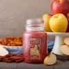 imageYankee Candle Kitchen Spice Scented Classic 22oz Large Jar Single Wick Over 110 Hours of Burn Time Ideal for Home Celebrations GiftingSugared Cinnamon Apple