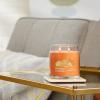 imageYankee Candle Studio Scented Candle with up to 50 Hour Burn Time Premium Plant Wax Blend for Consistent Burn 10 oz Jar Candle with Room Filling Fragrance Iced Berry LemonadeHoney Clementine