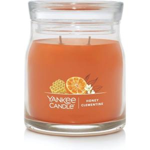 imageYankee Candle Studio Scented Candle with up to 50 Hour Burn Time Premium Plant Wax Blend for Consistent Burn 10 oz Jar Candle with Room Filling Fragrance Iced Berry LemonadeHoney Clementine