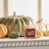 imageYankee Candle Studio Scented Candle with up to 50 Hour Burn Time Premium Plant Wax Blend for Consistent Burn 10 oz Jar Candle with Room Filling Fragrance Red Apple WreathAutumn Wreath