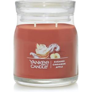 imageYankee Candle Studio Scented Candle with up to 50 Hour Burn Time Premium Plant Wax Blend for Consistent Burn 10 oz Jar Candle with Room Filling Fragrance Red Apple WreathSugared Cinnamon Apple